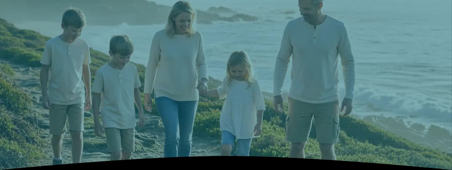 Family walking on grass